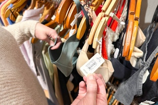 a person looking at aerie and american eagle underwear in store