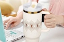 a tumbler with straw on a table