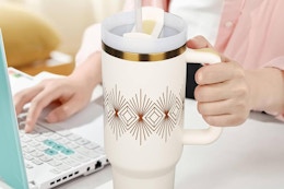 a tumbler with straw on a table