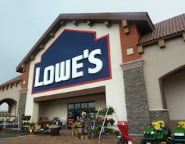 Lowe's storefront with plants and supplies outside