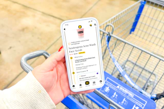 hand holding a smartphone displaying a 1-clip coupon deal in the kcl app