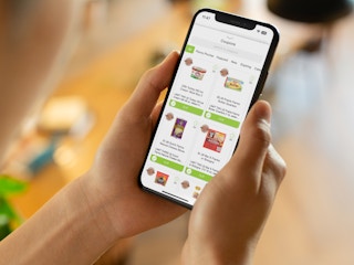 Someone looking at the myCountyMarket app on a phone