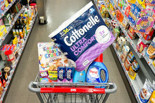 cottonelle toilet paper, cinnamon toast crunch cereal, crest toothpaste, ogx shampoo, and persil detergent in a cart