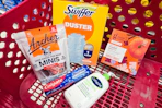 archers beef sticks, colgate toothpaste, cetaphil lotion, good & gather coffee pods, and swiffer dusters in a cart
