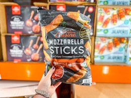 hand holding a bag of petite cuisine mozzarella sticks