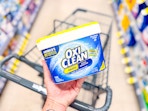 hand holding oxiclean