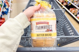 hand holding a bag of pepperidge farm bread