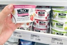 hand holding so delicious yogurt