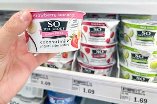 hand holding so delicious yogurt