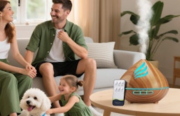 a essential oil diffuser on a table next to a family