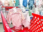 2 cloud island baby bodysuit 4-packs sitting in a target cart