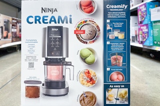 A Ninja Cream sitting on the floor in the middle of th aisle.