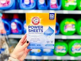 In-store photo of Arm & Hammer Power Sheets held up in laundry aisle at Walmart