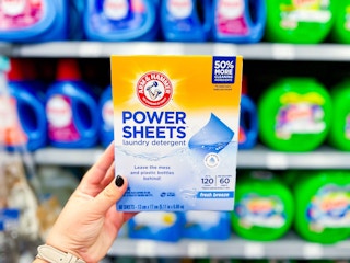In-store photo of Arm & Hammer Power Sheets held up in laundry aisle at Walmart