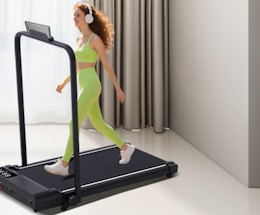 a person on a walking pad in a room