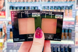 hand holding two Maybelline Fit Me blush