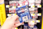 hand holding a pack of rayovac batteries