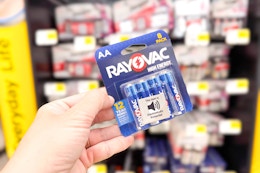 hand holding a pack of rayovac batteries