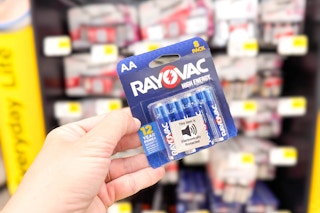 hand holding a pack of rayovac batteries