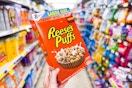 hand holding reese's puffs cereal at dollar general
