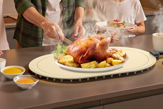 plate of chicken on top of warming mat