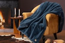 UGG Plush Faux Fur Throw Blanket on a living room chair.