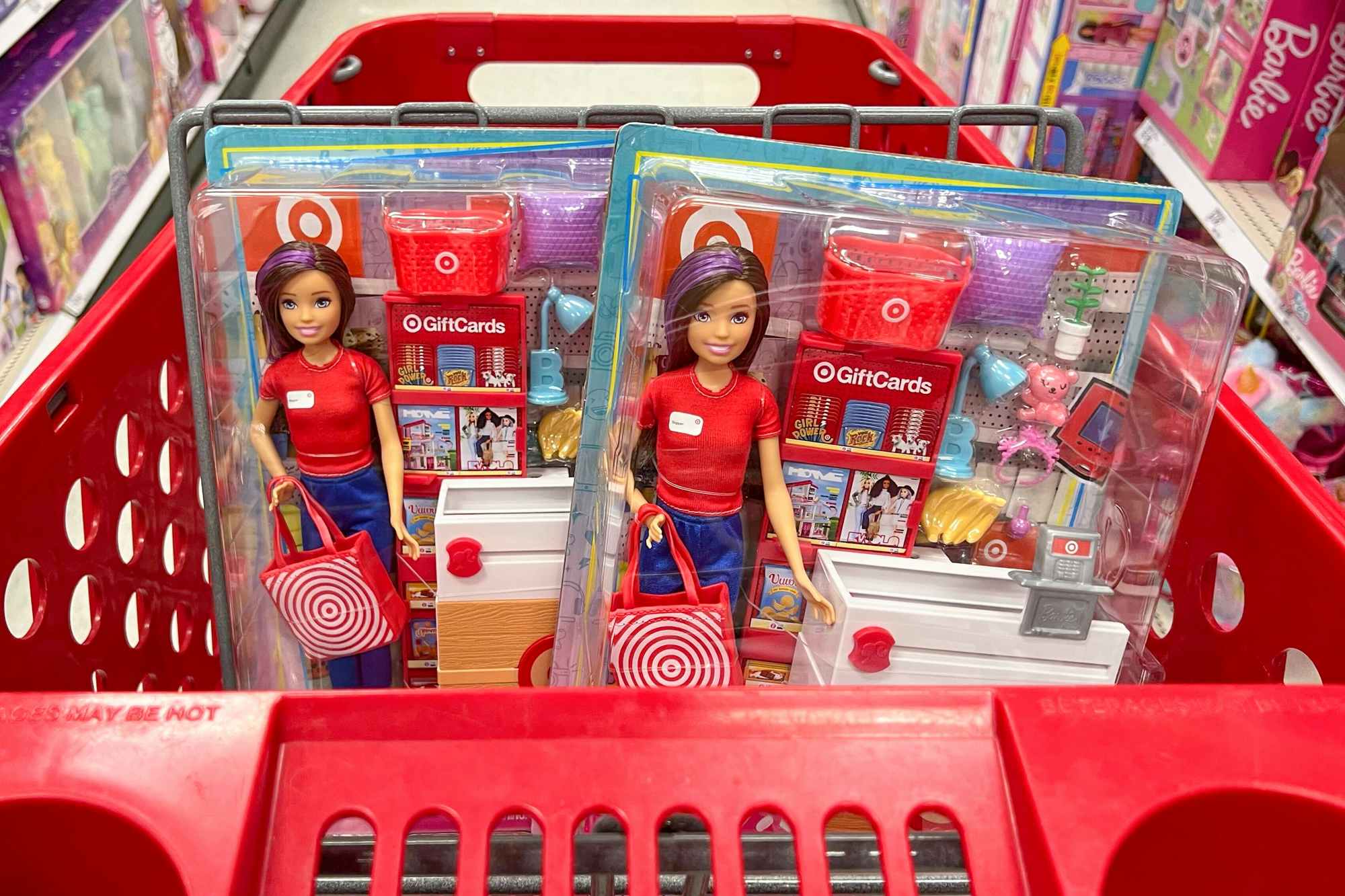 Target Barbie dolls in a cart