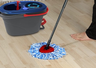 a person mopping the floor
