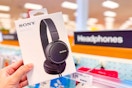 Black Sony Headphones held up in front of signage at target