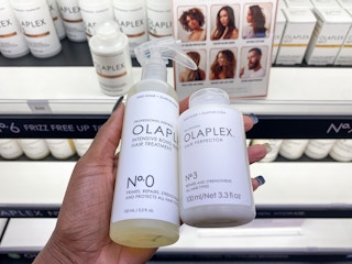 someone holding up olaplex