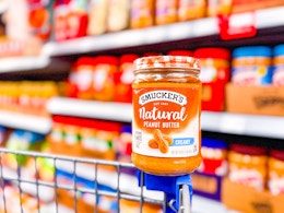 Smuckers Natural Peanut Butter on edge of a Walmart shopping cart