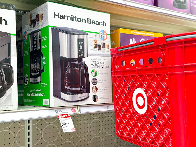 hamilton beach hot & iced coffee maker on shelf next to target cart