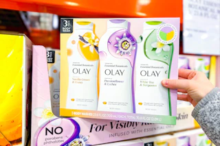 hand holding a pack of olay body wash