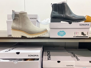 Gray and Black booties on their corresponding shoeboxes