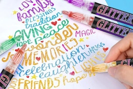 a hand drawing with metallic markers