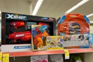 various clearance toys on shelf with 60% tag underneath