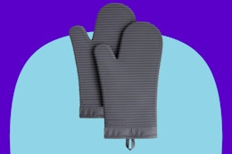 KitchenAid oven mitt on a blue background.