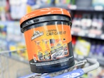 Armor All Car Care Kit sitting on the handle of a Walmart cart