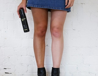 self tanner spray on someone's leg