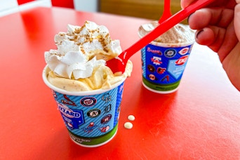 someone scooping a spoonful out of a Pumpkin Pie DQ Blizzard