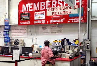 People standing at the Costco customer service desk