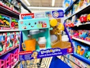 fisher price coffee cafe resting on walmart cart in aisle