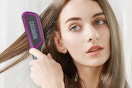 a woman brushing her hair