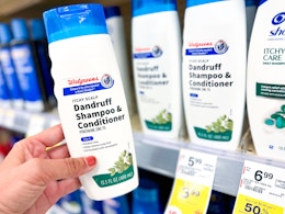 hand holding walgreens brand dandruff shampoo