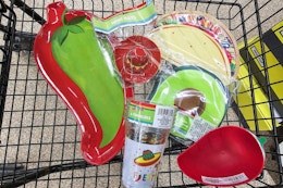 cinco de mayo party supplies in a cart