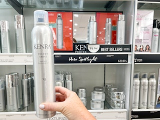Someone holding up a can of Kenra volume spray at Ulta