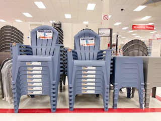 Patio chairs stacked on top of each other in a store.