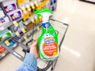 hand holding scrubbing bubbles grime fighter in walgreens