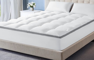 a mattress topper on a bed