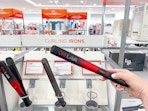 Someone holding up a CHI Lava hot styling tool at Ulta